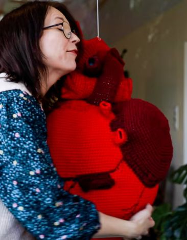 Eva hugging my crocheted heart