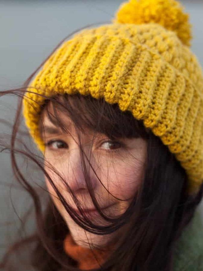 Jennifer Ramirez with mustard colored beanie