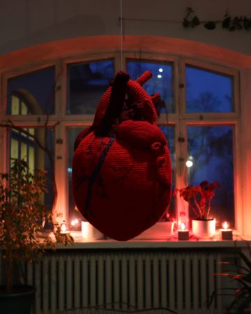 A big Red Anatomically Correct Heart Made In Crochet by Jennifer Ramirez