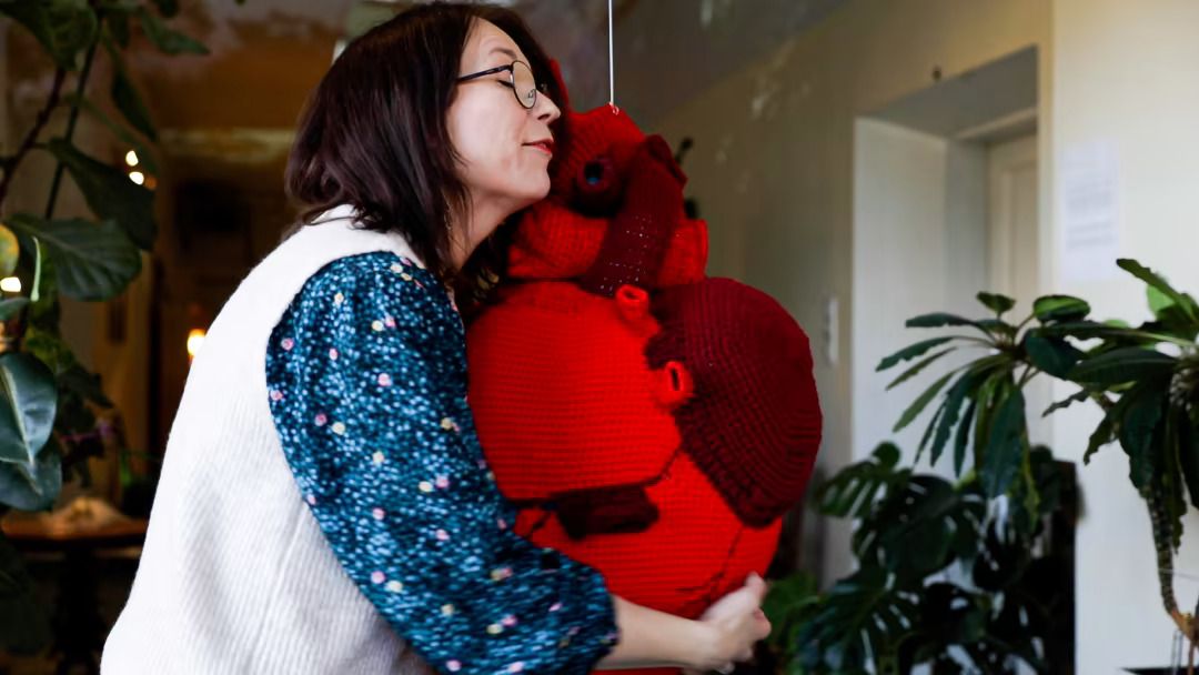 Eva hugging my crocheted heart